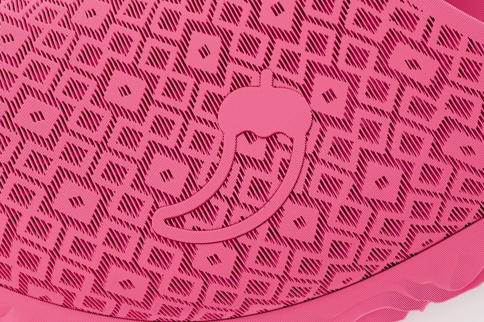 The Mule in Koobz pink, diamond back — the raised logo on the upper, close up